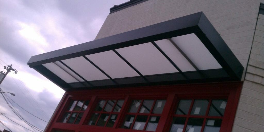 Aluminum Awnings With Overhead Support Suspended awnings that rely on hanger rods, support arms, or other overhead support are popular among brick-and-mortar business owners. Our Custom Canvas Works professionals can design custom aluminum suspended canopies that meet your individualized needs.